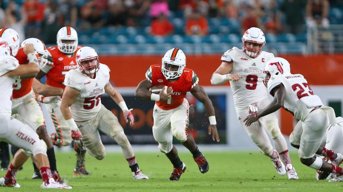 University of Miami Hurricanes running back Mark Walton (1) runs against the FAU Owls in the fourth quarter of an NCAA college football game, Saturday Sept. 10, 2016, in Miami Gardens.