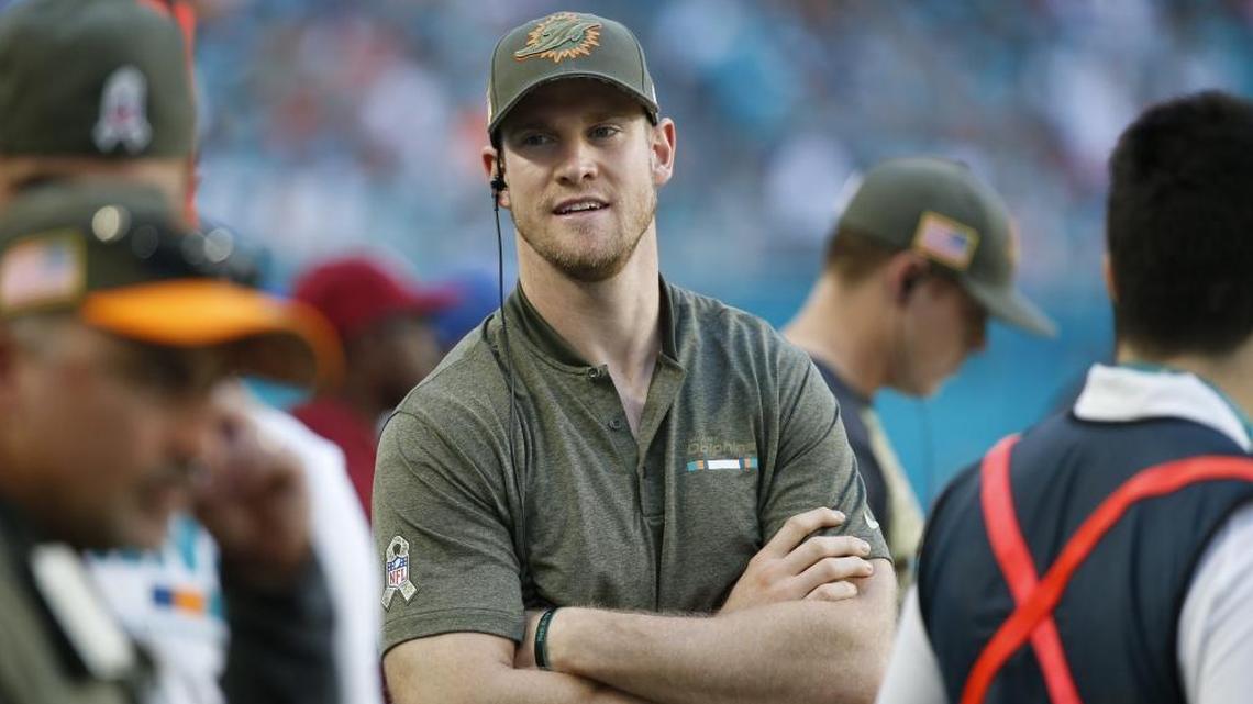 Miami Dolphins quarterback Ryan Tannehill, stands on the sidelines, during the second half of a game against Tampa Bay in November. Tannehill missed the 2017 season after knee surgery but the Dolphins say he will be their starter in 2018.