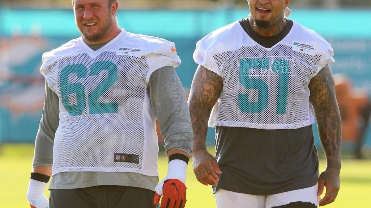 Miami Dolphins lineman Ted Larsen (62) and Mike Pouncey (51) during training camp at the Miami Dolphins training facility in Davie, Fla., July 28, 2017.