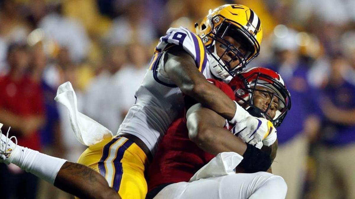 LSU defensive end/linebacker Arden Key (49) sacks Jacksonville State quarterback Eli Jenkins in a game earlier this season. Key is considered one of the top front seven players available in next year’s draft.