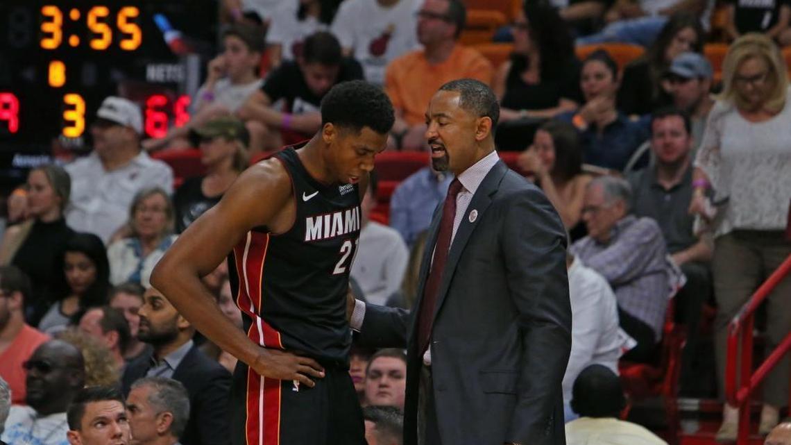Miami Heat center Hassan Whiteside talks with Heat assistant coach Juwan Howard during the third quarter of an NBA basketball game at the AmericanAirlines Arena in Miami on Saturday, March 31, 2018.