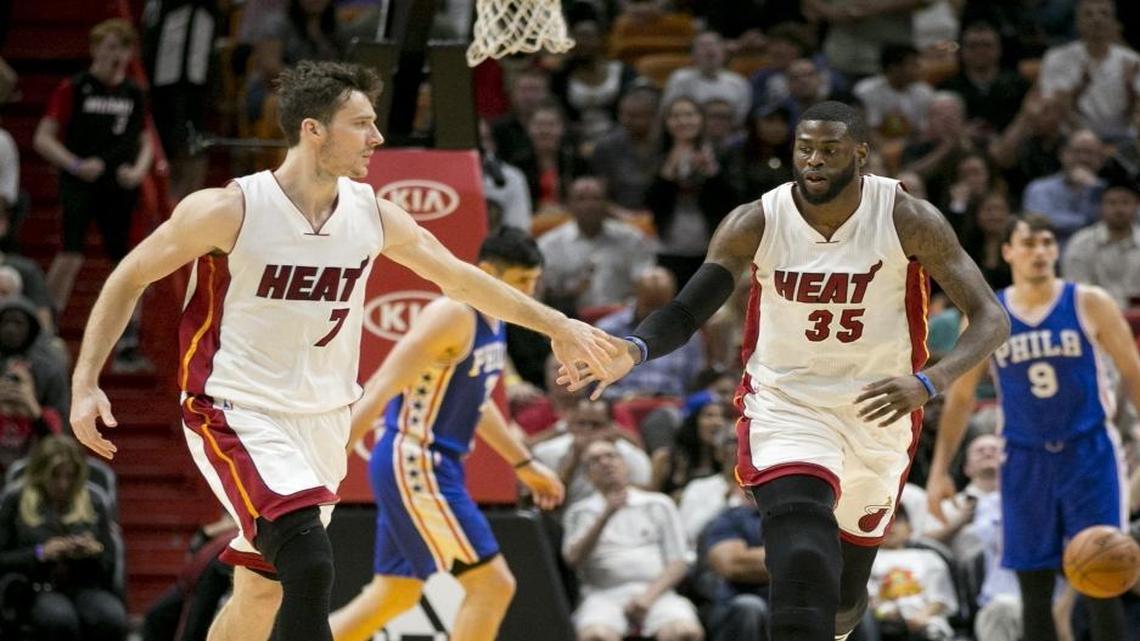 Miami Heat guard Goran Dragic (7) and forward Willie Reed (35) celebrate after Reed scores in the second half as the Miami Heat host the Philadelphia 76ers at the American Airlines Arena on Saturday, February 4, 2017.