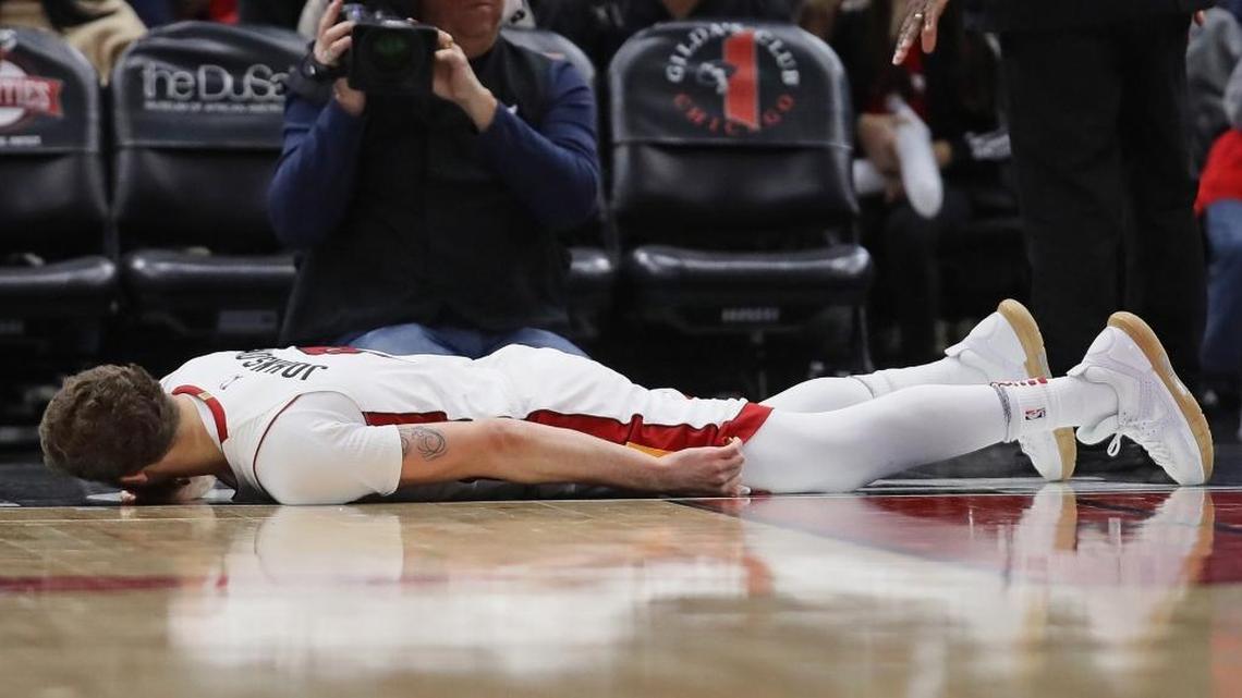 Former Heat guard Tyler Johnson lies on the floor after sustaining a sprained left ankle in a game against the Bulls at United Center. Johnson was carted off but X-rays were negative. Ankle injuries are common in basketball.