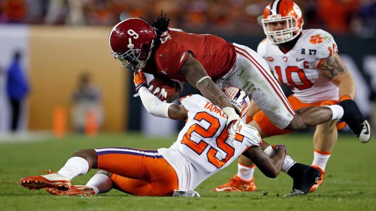 Alabama's Bo Scarbrough is stopped by Clemson's Cordrea Tankersley during the second half of the NCAA college football playoff championship game Mon., Jan. 9, 2017, in Tampa, Fla.