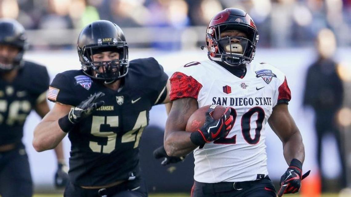 San Diego State running back Rashaad Penny (20) runs for a touchdown against Army in the Armed Forces Bowl in Fort Worth, Texas, last December. The Dolphins are intrigued by Penny’s skills. (Steve Nurenberg/Star-Telegram via AP)