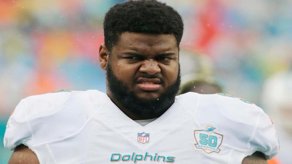 Miami Dolphins defensive tackle Jordan Phillips (97) walks the sidelines during the first half of an NFL football game against the Dallas Cowboys, Sunday, Nov. 22, 2015, in Miami Gardens, Fla.