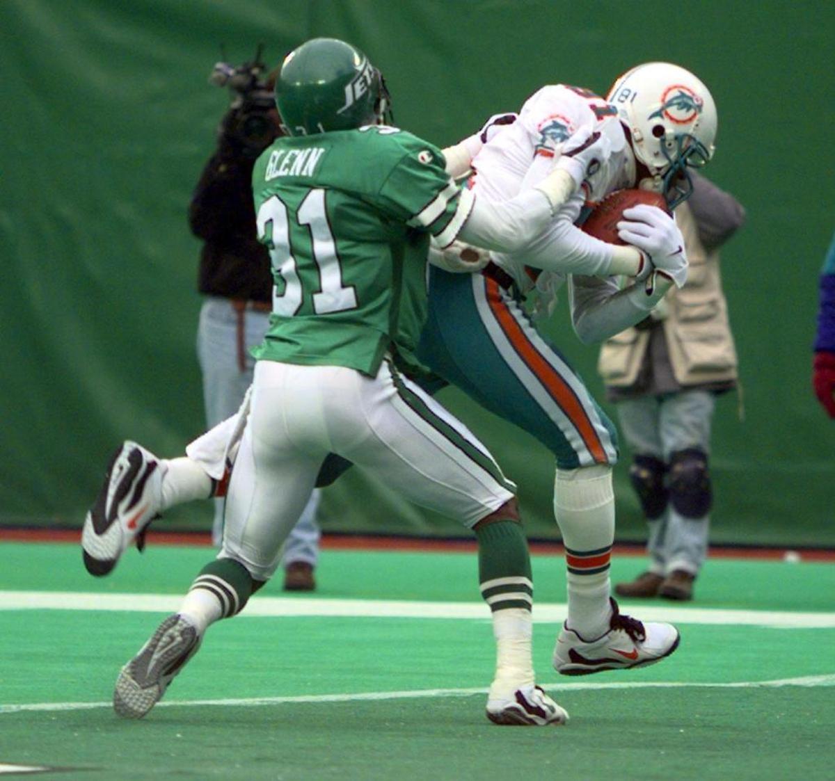 Dolphins receiver O.J. McDuffie makes a catch during a game against the Jets in 1996. McDuffie said his son was called a racial slur at a Florida Keys resort in August 2020.