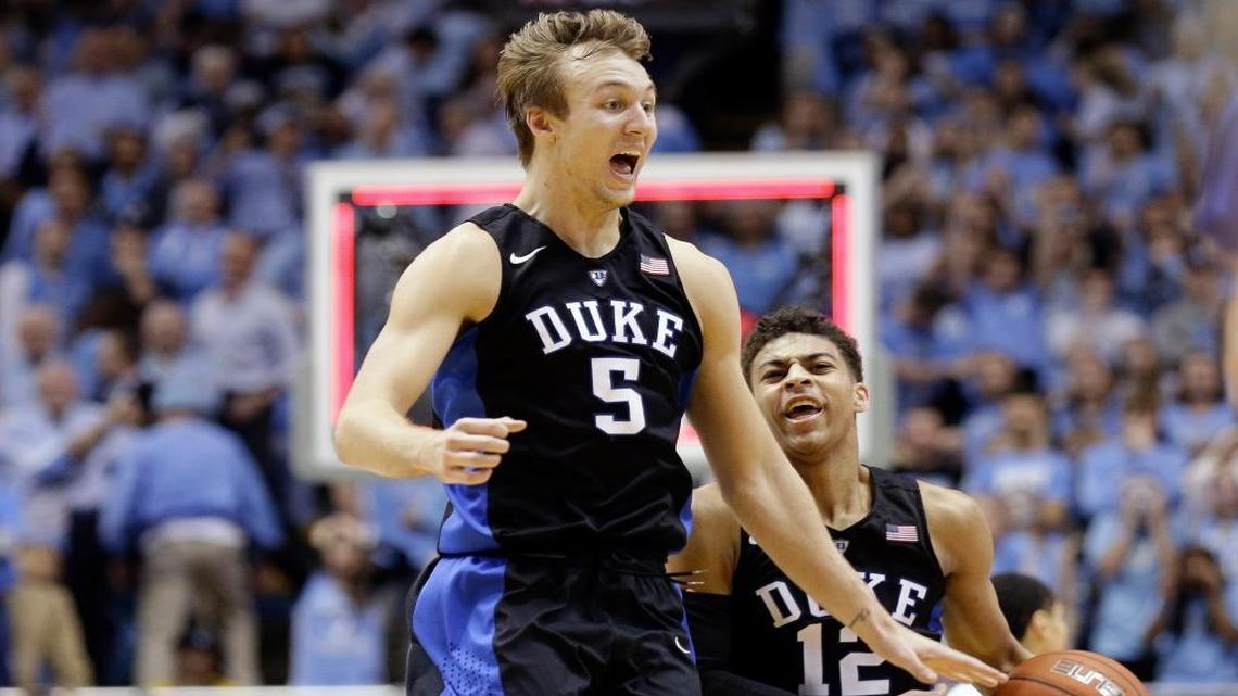Duke's Luke Kennard (5) and Derryck Thornton (12) celebrate the team's 74-73 victory over North Carolina in an NCAA college basketball game in Chapel Hill, N.C., Wed., Feb. 17, 2016.