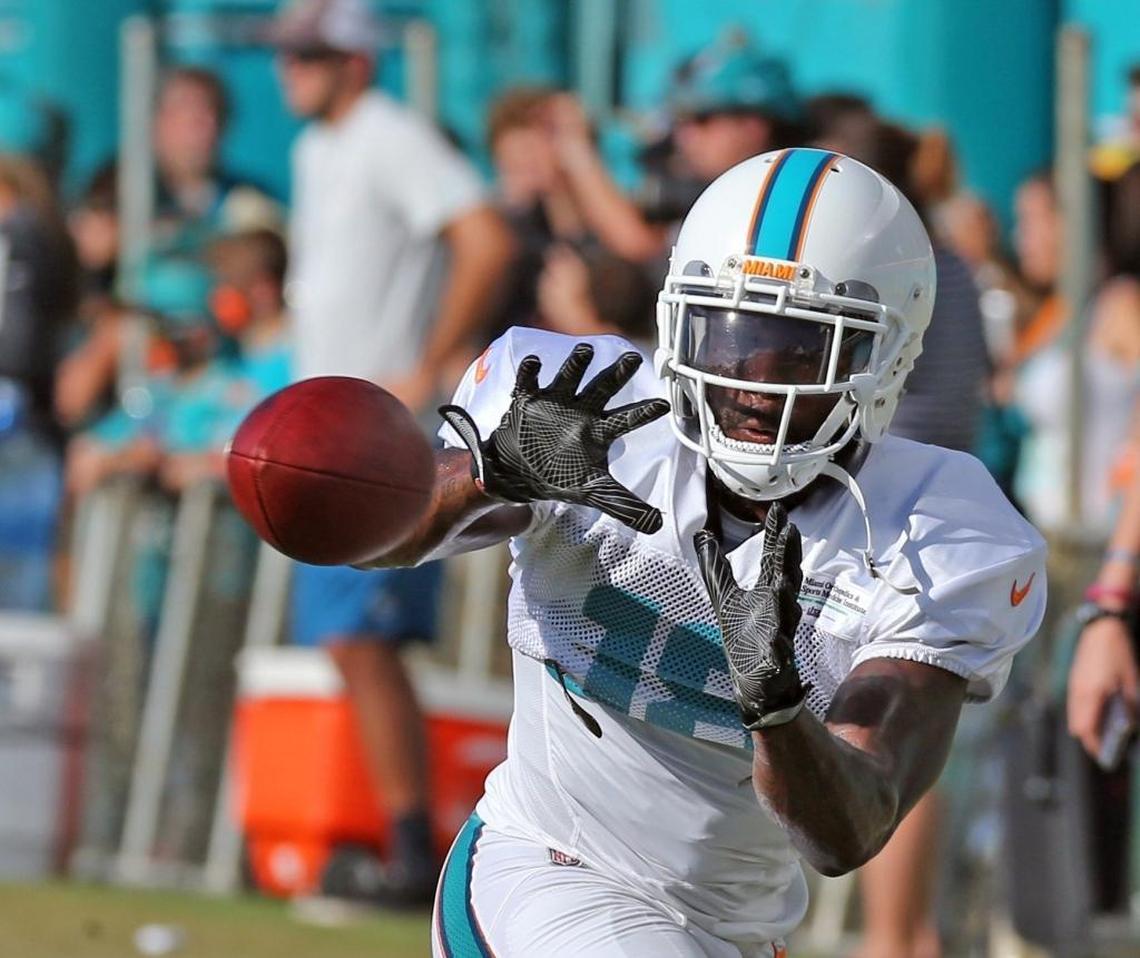 Miami Dolphins WR Malcolm Lewis reaches for a pass during training camp at the Miami Dolphins training facility in Davie, Fl, August 2, 2017.