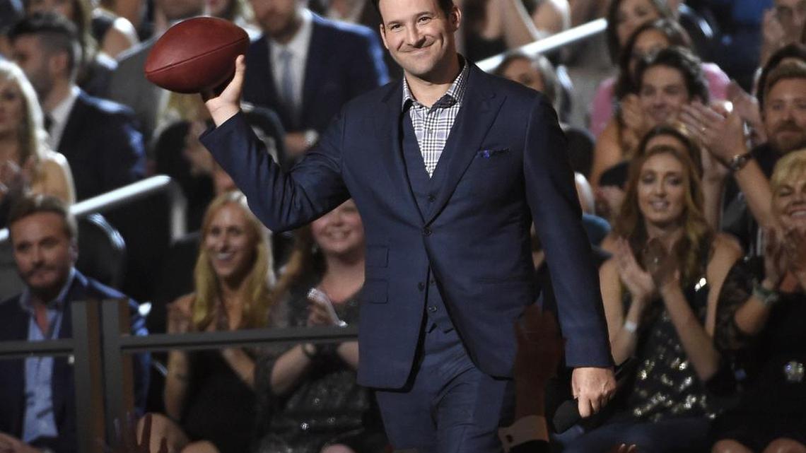 In this April 19, 2015, photo, Tony Romo walks on stage at the 50th annual Academy of Country Music Awards at AT&T Stadium, in Arlington, Texas.