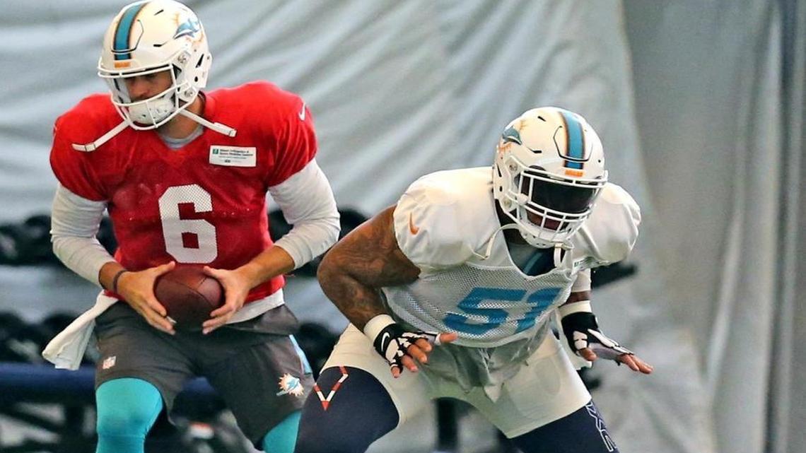 Dolphins center Mike Pouncey (51) and quarterback Jay Cutler (6) at the Miami Dolphins training facility in Davie, FL, Aug. 28, 2017.