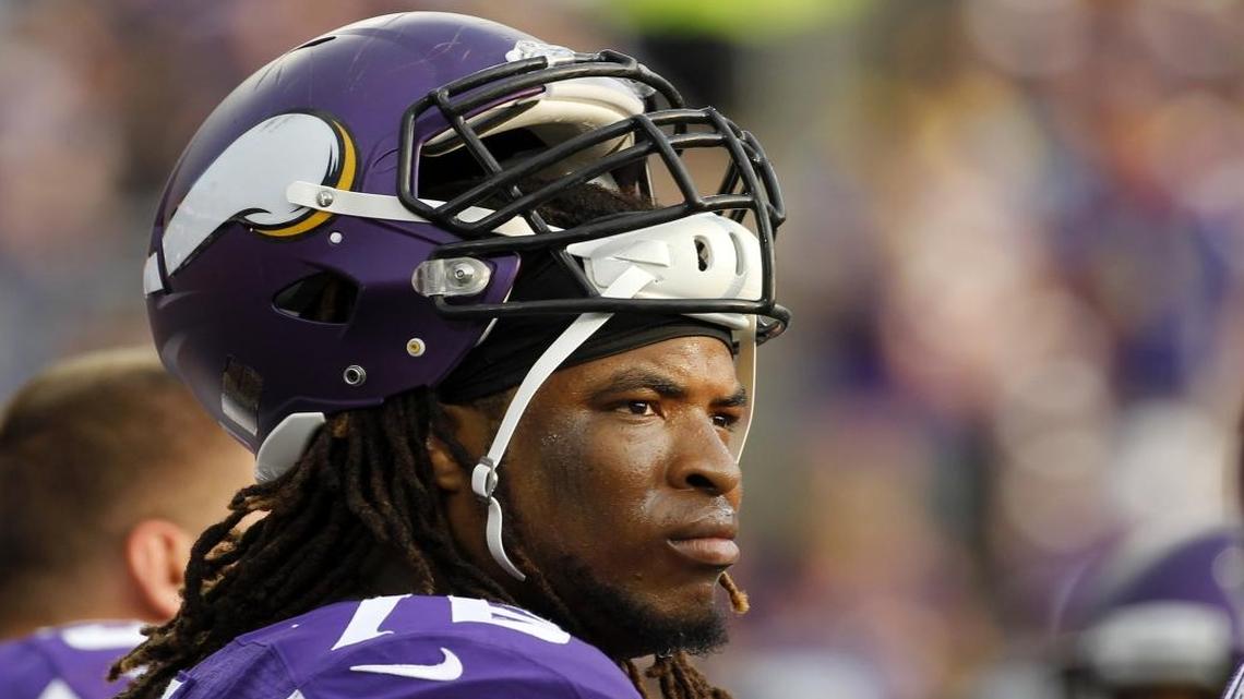Minnesota Vikings tackle Isame Facian looks on during the first half of an NFL preseason football game against the Arizona Cardinals, Saturday, Aug. 16, 2014, in Minneapolis.