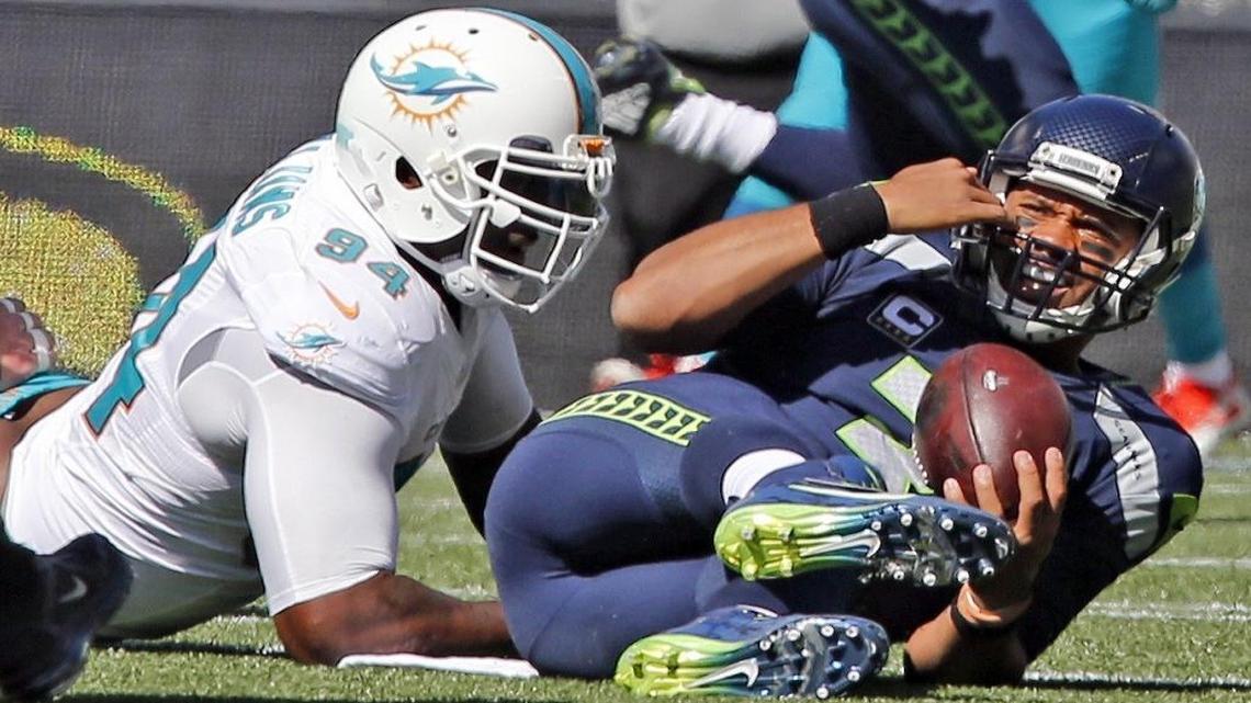 Miami Dolphins Mario Williams sacks Seattle Seahawks quarterback Russell Wilson in the first quarter at CenturyLink Field in Seattle, WA, Sept. 11, 2016.