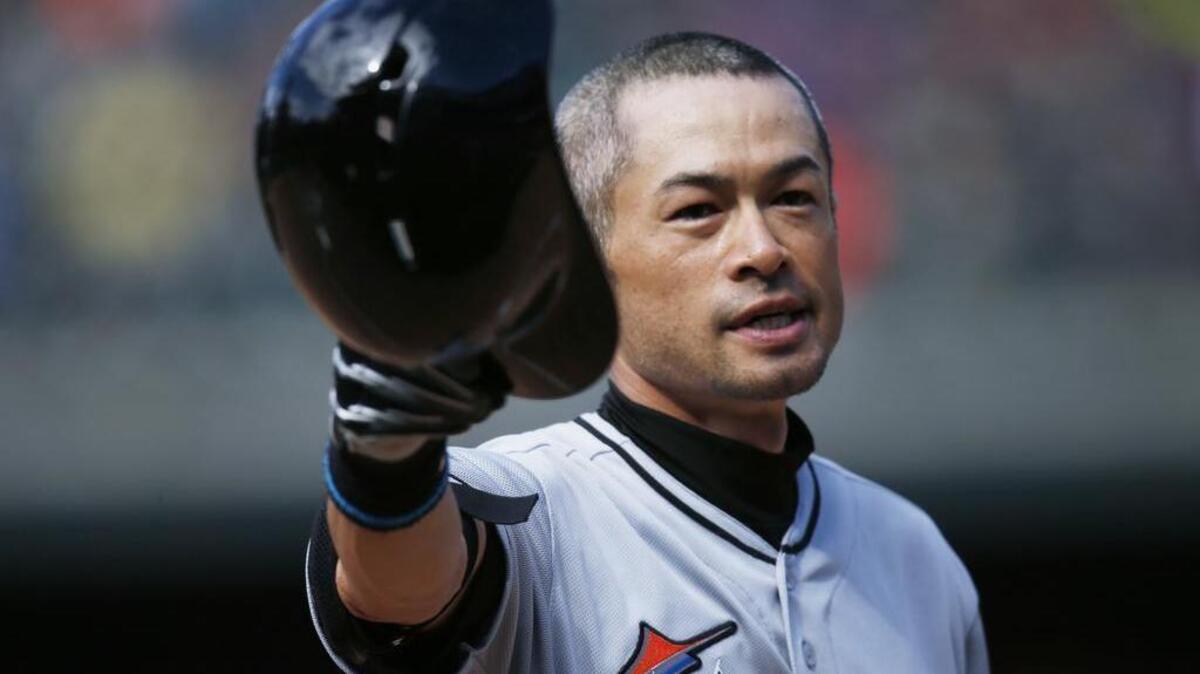 Miami Marlins' Ichiro Suzuki tips his batting helmet to the crowd as fans applaud after he hit a triple off Colorado Rockies relief pitcher Chris Rusin in the seventh inning of a baseball game, Sunday, Aug. 7, 2016 in Denver. The hit was the 3,000th in his Major League career.