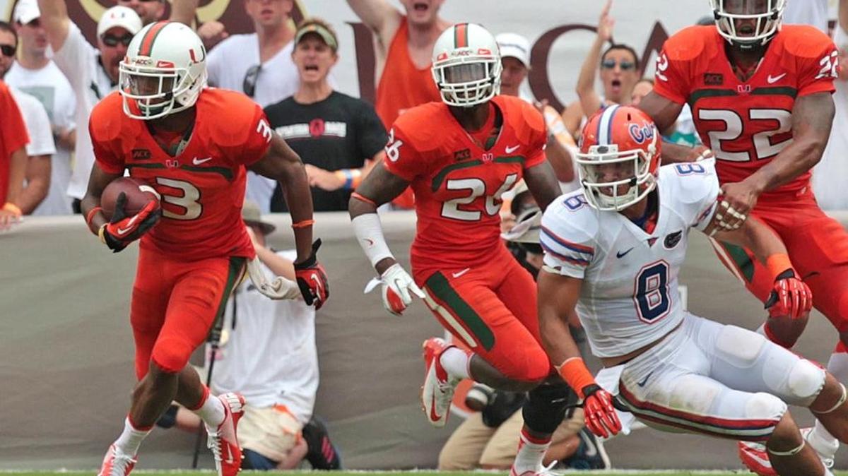 Miami’s Tracy Howard intercepts a pass during the University of Miami Hurricanes football game against the University of Florida Gators in 2013. Howard is now a member of the Dolphins’ practice squad.