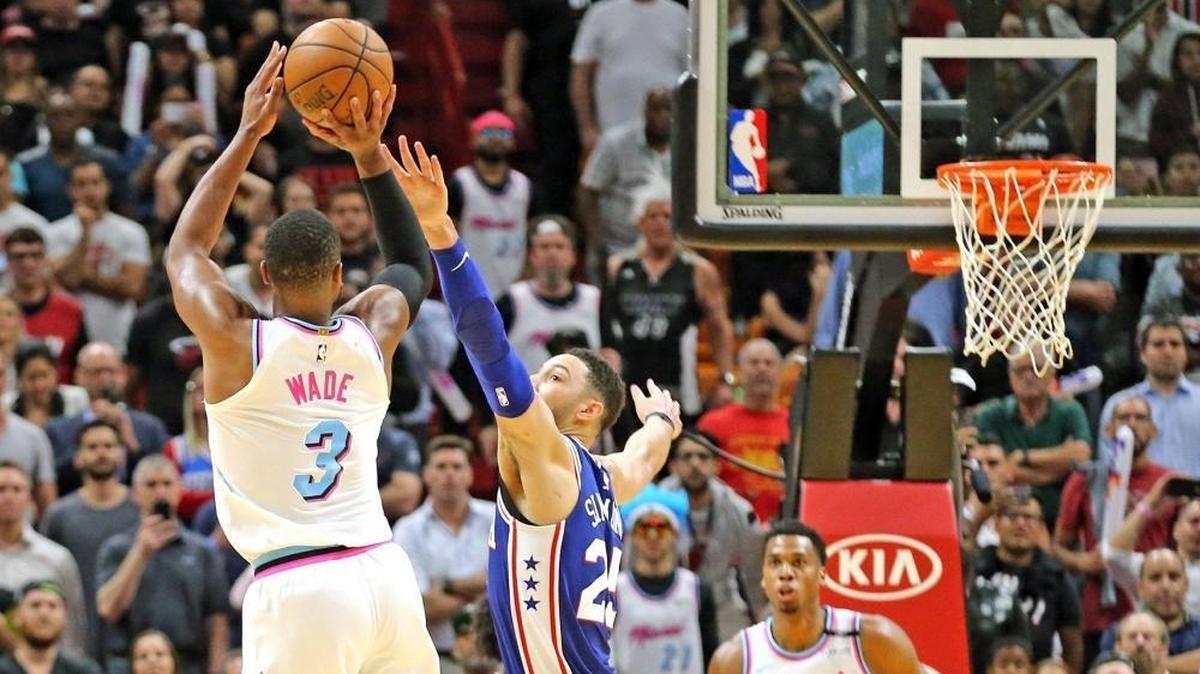 Heat guard Dwyane Wade shoots the winning basket against Philadelphia on Tuesday. Coach Erik Spoelstra said he wants Wade to continue to come off the bench, even with Miami depleted at shooting guard.