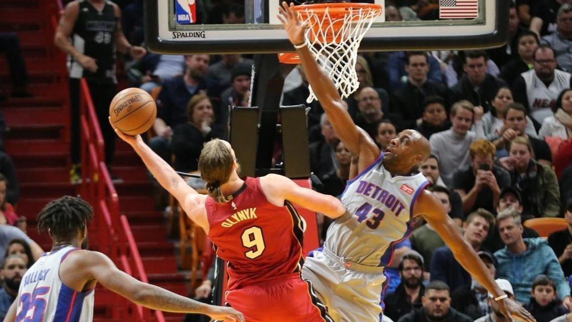 Miami Heat forward/center Kelly Olynyk (9) scores an important basket in the final seconds of Wednesday’s game as Detroit Pistons forward Anthony Tolliver (43) defends him.