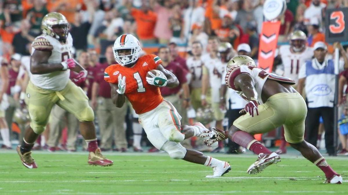 University of Miami Hurricanes running back Mark Walton, (1) runs the ball in the second quarter of an NCAA college football game against Florida State Seminoles at Hard Rock Stadium on Sat., Oct. 8, 2016, in Miami Gardens.