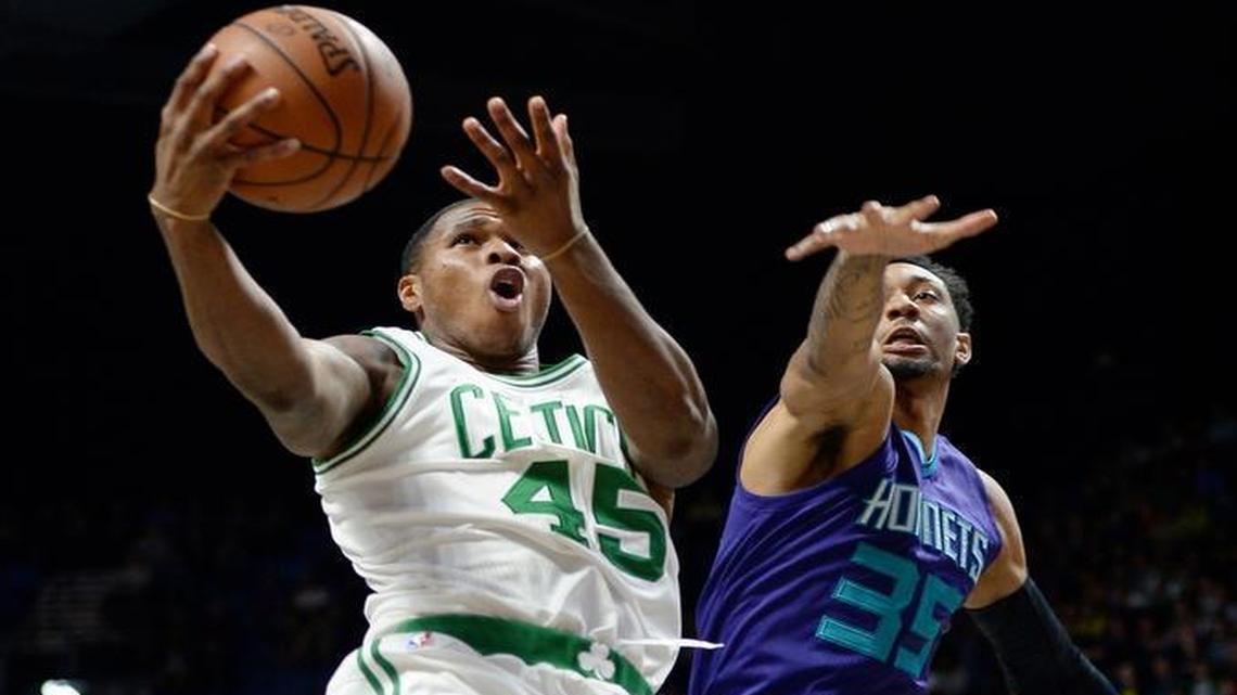 Boston Celtics' Marcus Georges-Hunt goes up for a basket, left, as Charlotte Hornets' Christian Wood, right, defends during the second half of an NBA preseason basketball game, Sat., Oct. 8, 2016, in Uncasville, Conn.