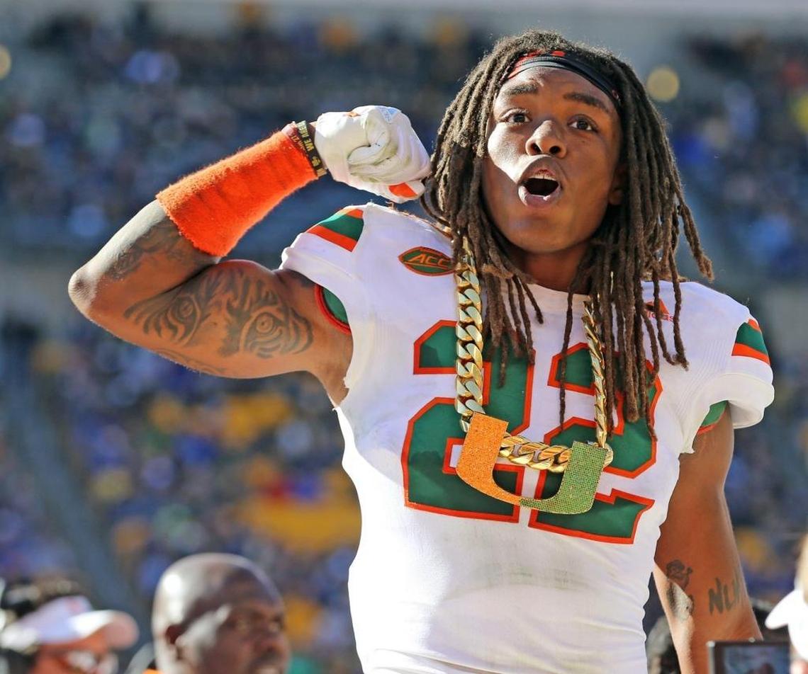 Miami Hurricanes safety Sheldrick Redwine, No. 22, gets the turnover chain after recovering the ball in the second quarter against Pitt at Heinz Field in Pittsburgh, Pa., on Nov. 24, 2017. Redwine had secured the job of starter, opposite Jaquan Johnson, as 2018 fall camp was about to begin.