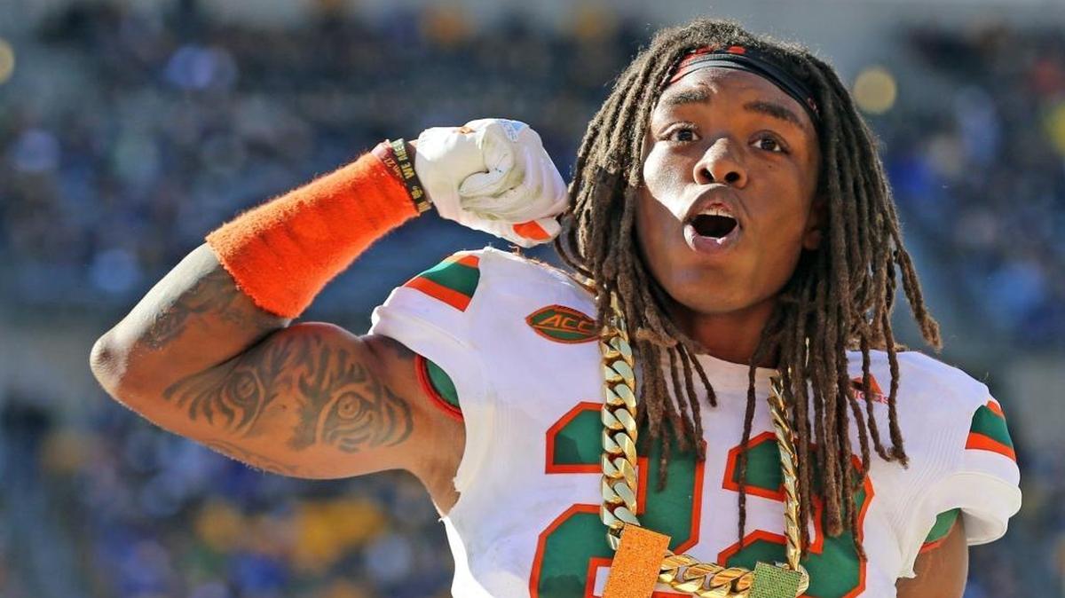 Miami Hurricanes safety Sheldrick Redwine, No. 22, gets the turnover chain after recovering the ball in the second quarter against Pitt at Heinz Field in Pittsburgh, Pa., on Nov. 24, 2017. Redwine had secured the job of starter, opposite Jaquan Johnson, as 2018 fall camp was about to begin.
