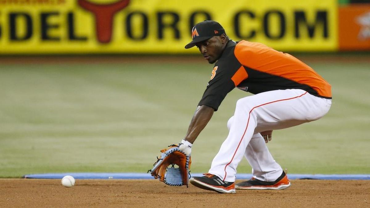 Miami Marlins shortstop Adeiny Hechavarria fielding a ground ball during practice before the start of a baseball game against the Oakland Athletics at Marlins Park on Tues., June 13, 2017 in Miami.