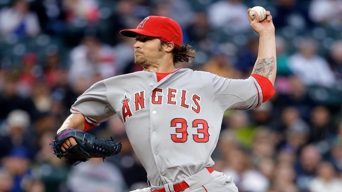 Los Angeles Angels starting pitcher C.J. Wilson throws against the Seattle Mariners during the first inning of a baseball game Tues., April 7, 2015, in Seattle.