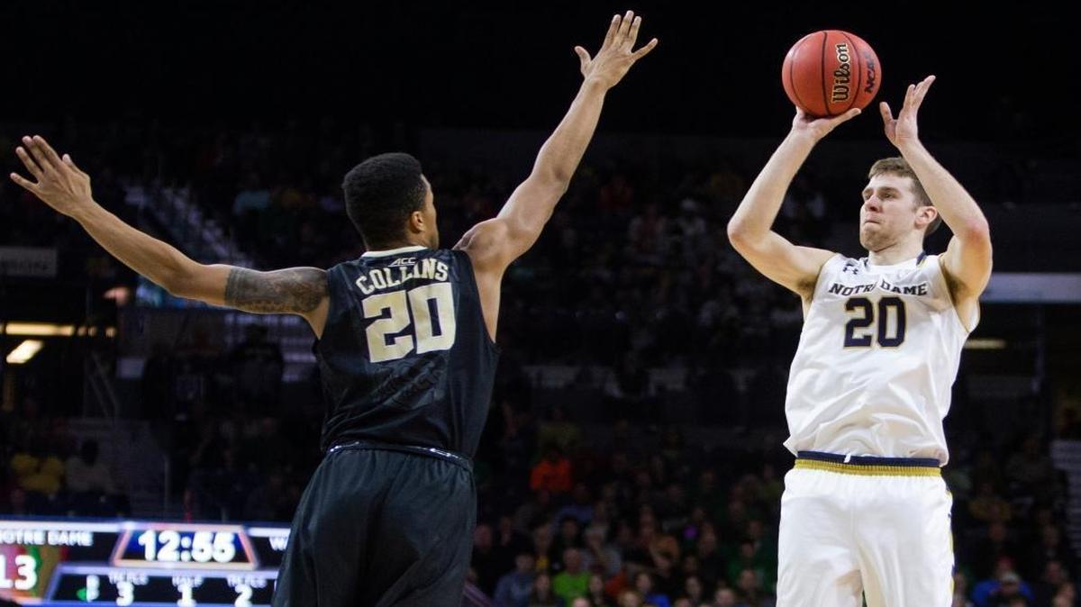 Notre Dame’s Austin Burgett (20) shoots over Wake Forest’s John Collins (20) during the first half of an NCAA college basketball game Sun., Jan. 31, 2016, in South Bend, Ind.