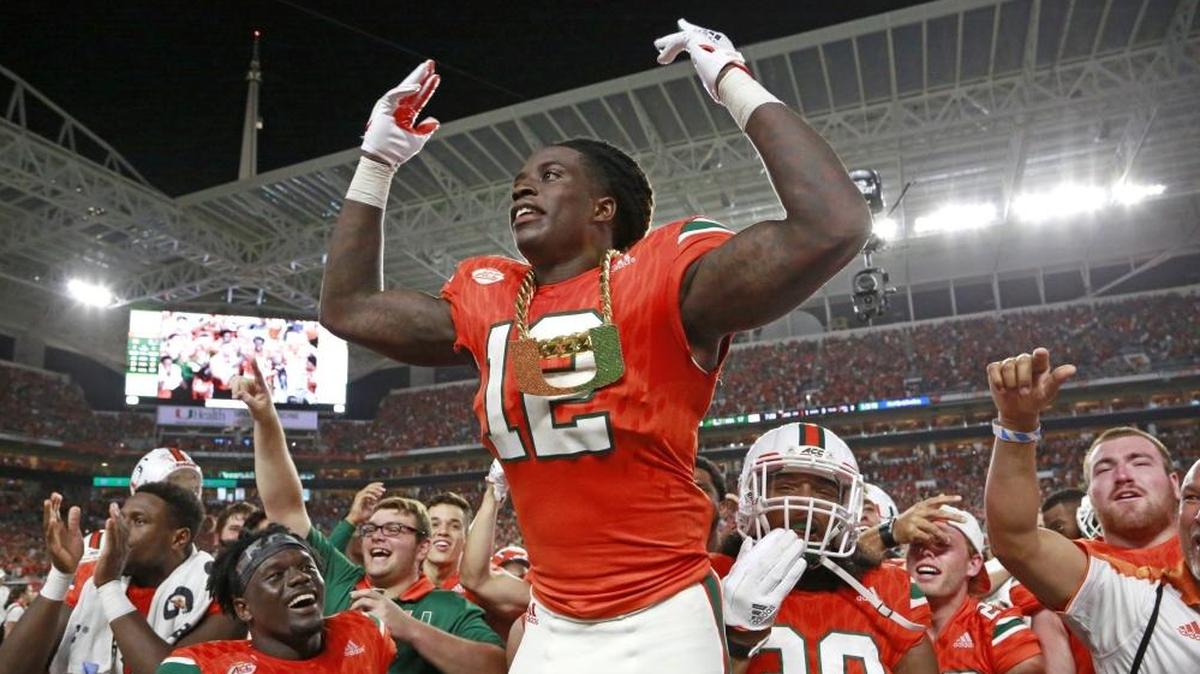 Miami Hurricanes defensive back Malek Young (12) wears the turnover chain after intercepting in the second quarter as the University of Miami Hurricanes host Notre Dame Fighting Irish at Hard Rock Stadium on Sat., Nov. 11, 2017.