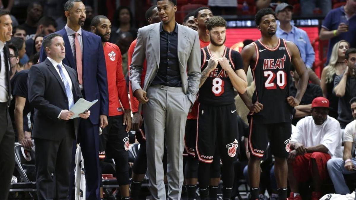 Miami Heat's Hassan Whiteside remains out with a bone bruise on his left knee, with still no firm timetable for his return.