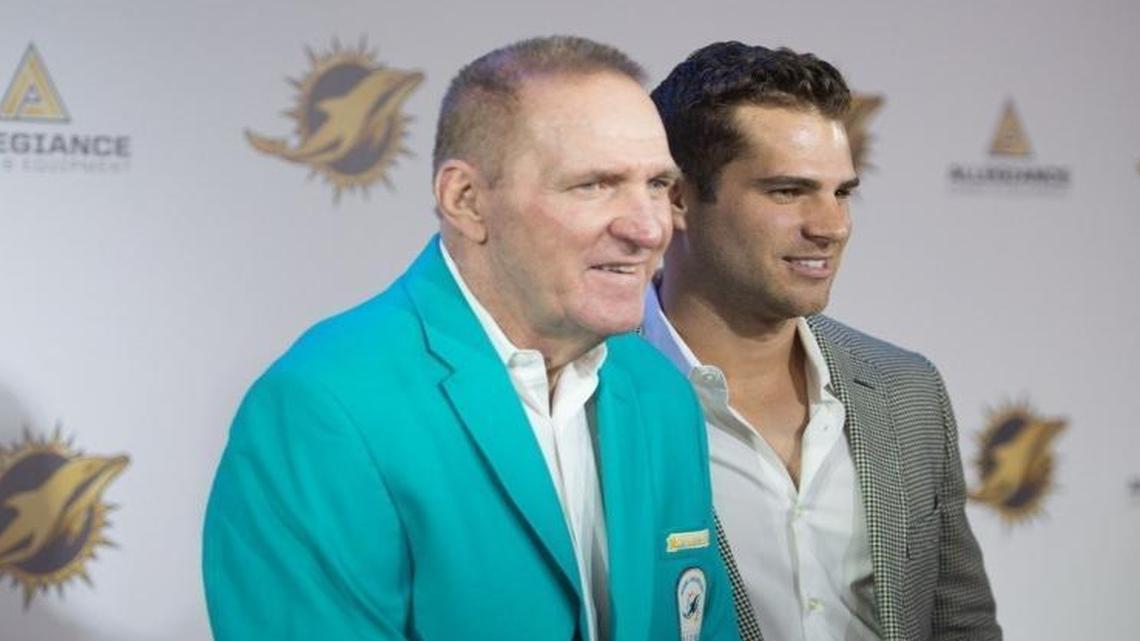 Jim Kiick and son Austin Kiick pose for photos during a red carpet event at the Dolphins gala for the 50th Season All Time Team at the Dilpomat Resort and Spa in Hollywood, Fla., on Dec. 11, 2015.