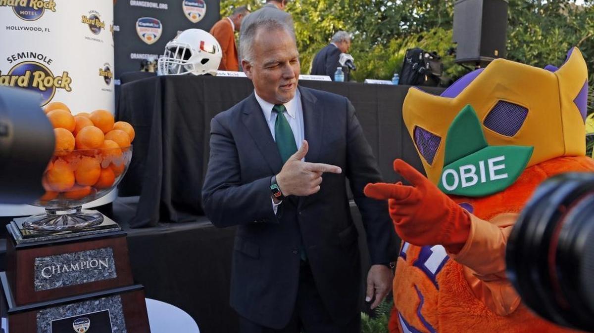 Miami’s Mark Richt with Orange Bowl mascot Obie during the 2017 Capital One Orange Bowl Head Coaches news conference at the Seminole Hard Rock Hotel on Dec. 6. Richt is pushing hard to add defensive linemen before National Signing Day on Feb. 7.