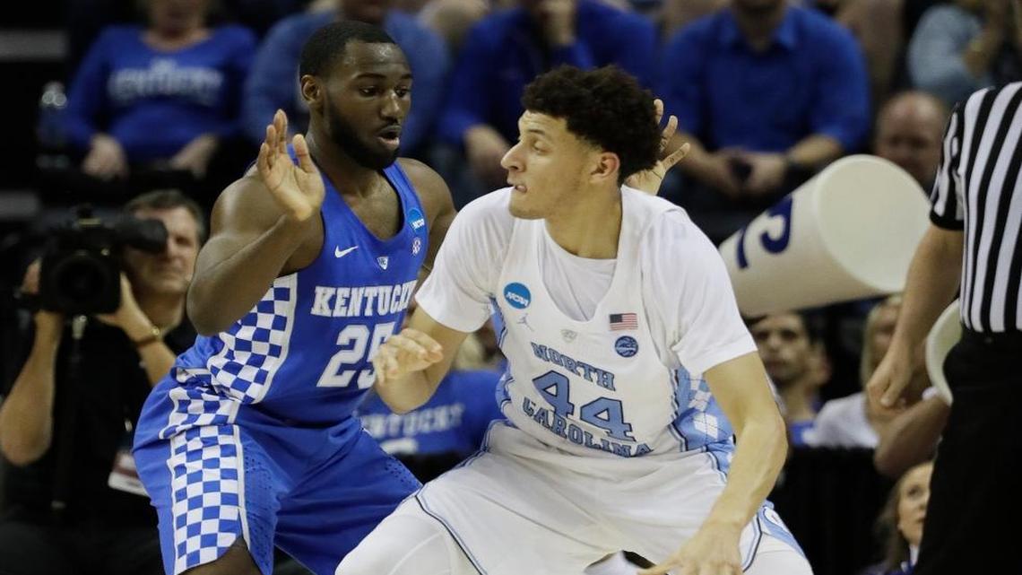 North Carolina forward Justin Jackson (44) drives on Kentucky guard Dominique Hawkins (25) in the first half of the South Regional final game in the NCAA college basketball tournament Sun., March 26, 2017, in Memphis, Tenn.