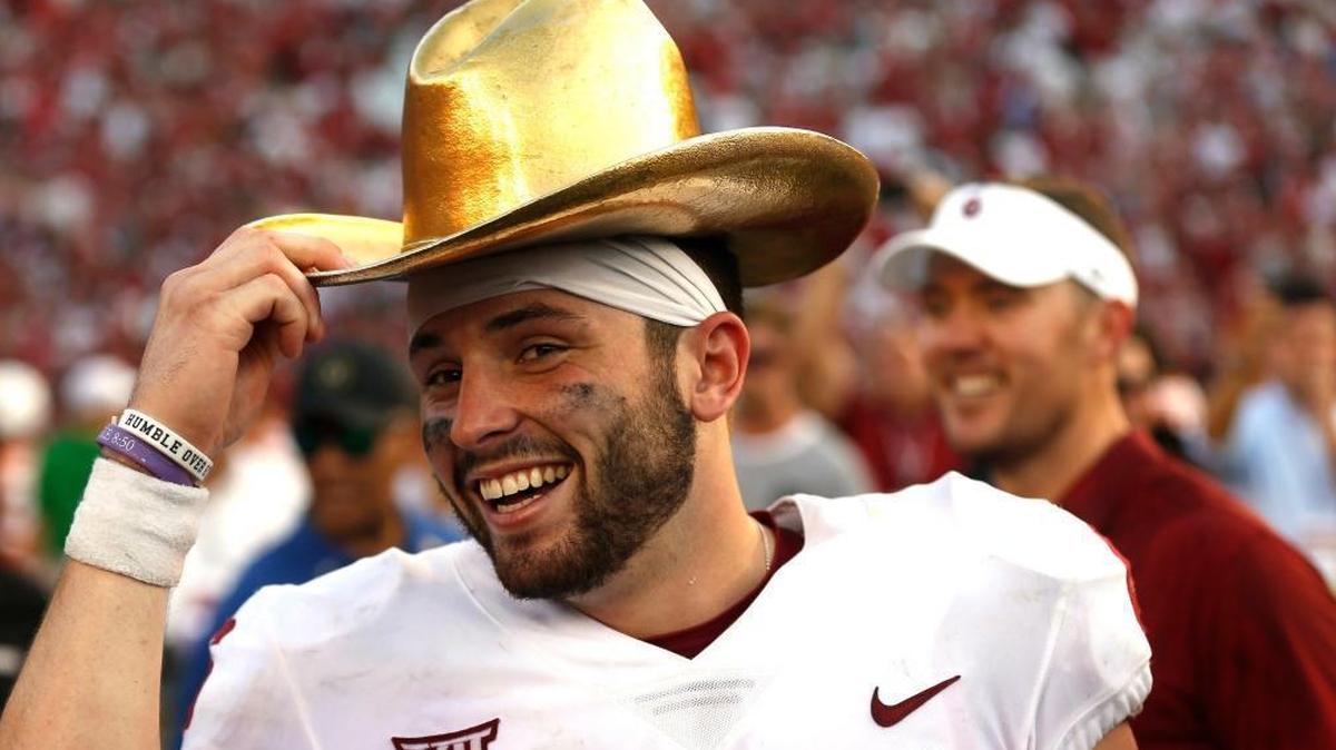 Oklahoma quarterback Baker Mayfield (6) celebrates with the Golden Hat Trophy following the team's 29-24 win over Texas in an NCAA college football game in Dallas. Baker Mayfield is the AP player of the year, becoming the fourth Oklahoma quarterback to win the award since it was established in 1998.