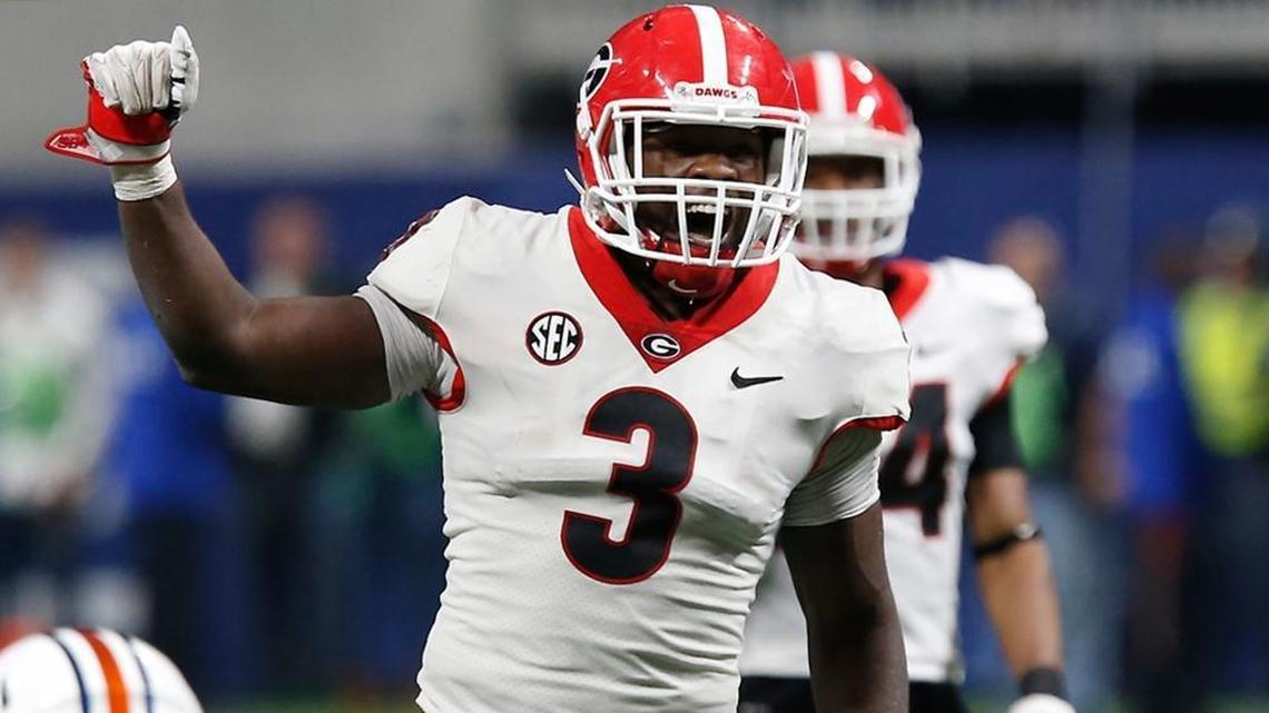 Georgia linebacker Roquan Smith (3) yells out commands before Auburn runs a play during the Dec. 4 SEC Championship in Atlanta. Smith is a draft possibility for the Dolphins.