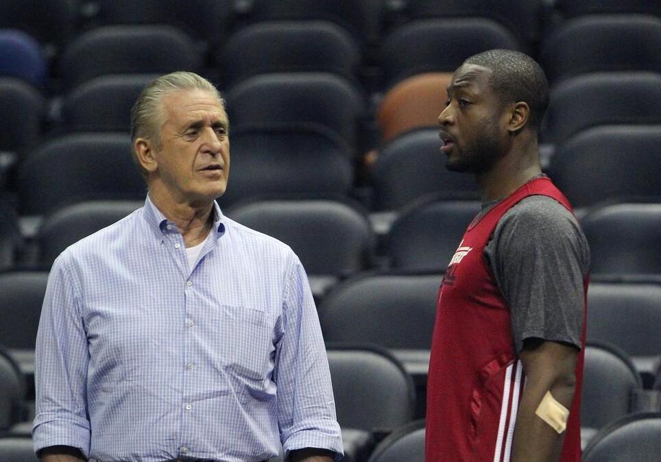 
Miami Heat president Pat Riley Heat, left, talks with Miami Heat guard Dwyane Wade during the team's practice at the AT&T Center in San Antonio on June 12, 2013.
