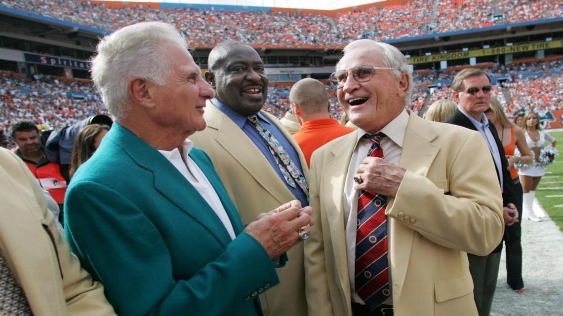 Dolphins Hall of Famers Nick Buoniconti, left, Larry Little, center, and Don Shula chat before a halftime Hall of Fame ring presentation for quarterback Dan Marino at Dolphins Stadium in this Nov. 6, 2005, file photo. The plight of former Dolphins great Nick Buoniconti has shone new light on football brain injuries -- and the NFL’s moral obligation to do more.