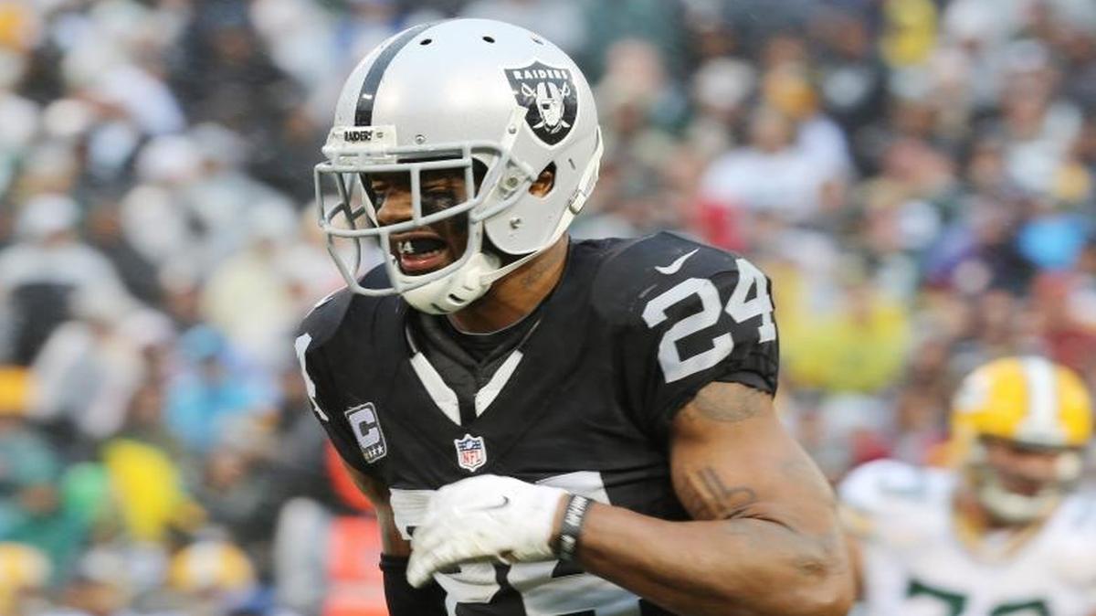 Oakland Raiders free safety Charles Woodson (24) grimaces as he walks off the field with an injury during the second half of an NFL football game against the Green Bay Packers Sunday, Dec. 20, 2015, in Oakland, Calif.