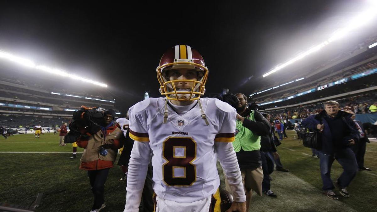 Washington Redskins' Kirk Cousins walks the field after an NFL football game against the Philadelphia Eagles, Saturday, Dec. 26, 2015, in Philadelphia. Washington won 38-24.