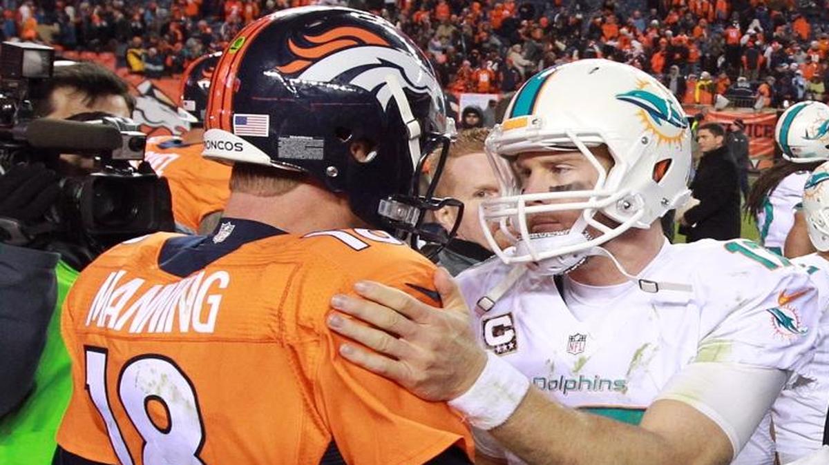 Miami Dolphins quarterback Ryan Tannehill, right, greets Denver Broncos quarterback Peyton Manning after a game in Denver on November 23, 2014.