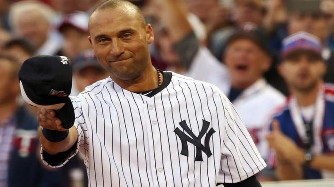 American League shortstop Derek Jeter, of the New York Yankees, waves as he is taken out of the game in the top of the fourth inning of the MLB All-Star baseball game, Tues., July 15, 2014, in Minneapolis.