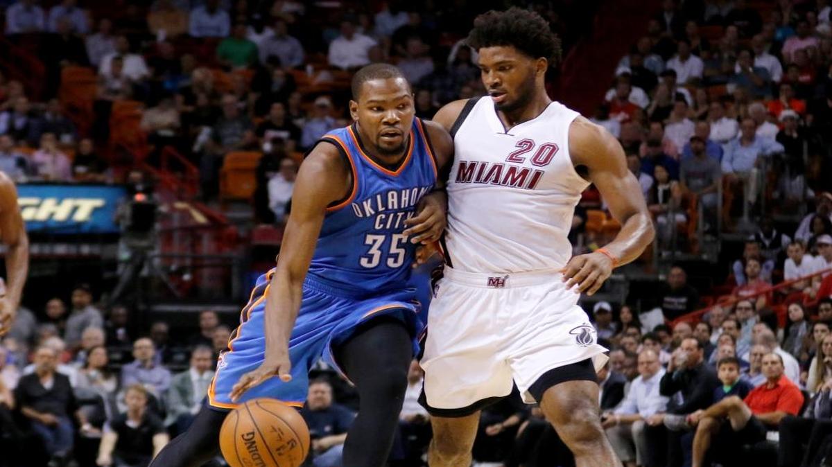 Oklahoma City Thunder forward Kevin Durant (35) drives past Miami Heat forward Justise Winslow (20) Thursday, Dec. 3, 2015, in Miami.