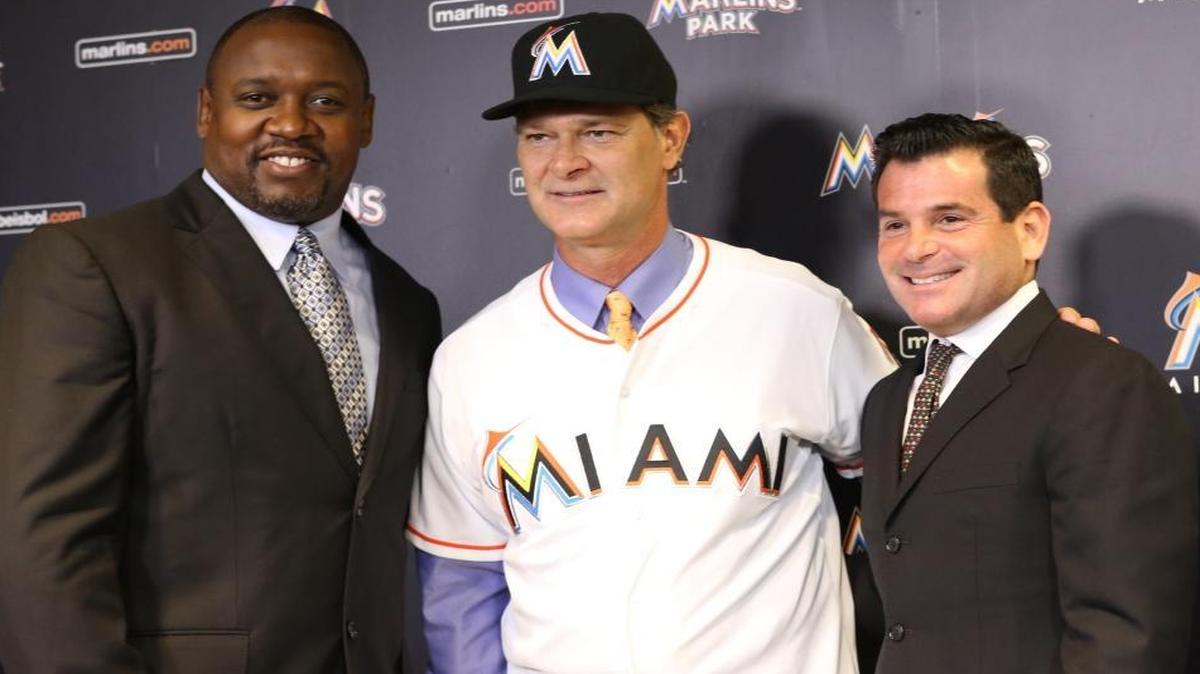New Miami Marlins manager Don Mattingly poses with president of baseball operations Michael Hill, left, and team president David Samson on Monday, November 2, 2015.
