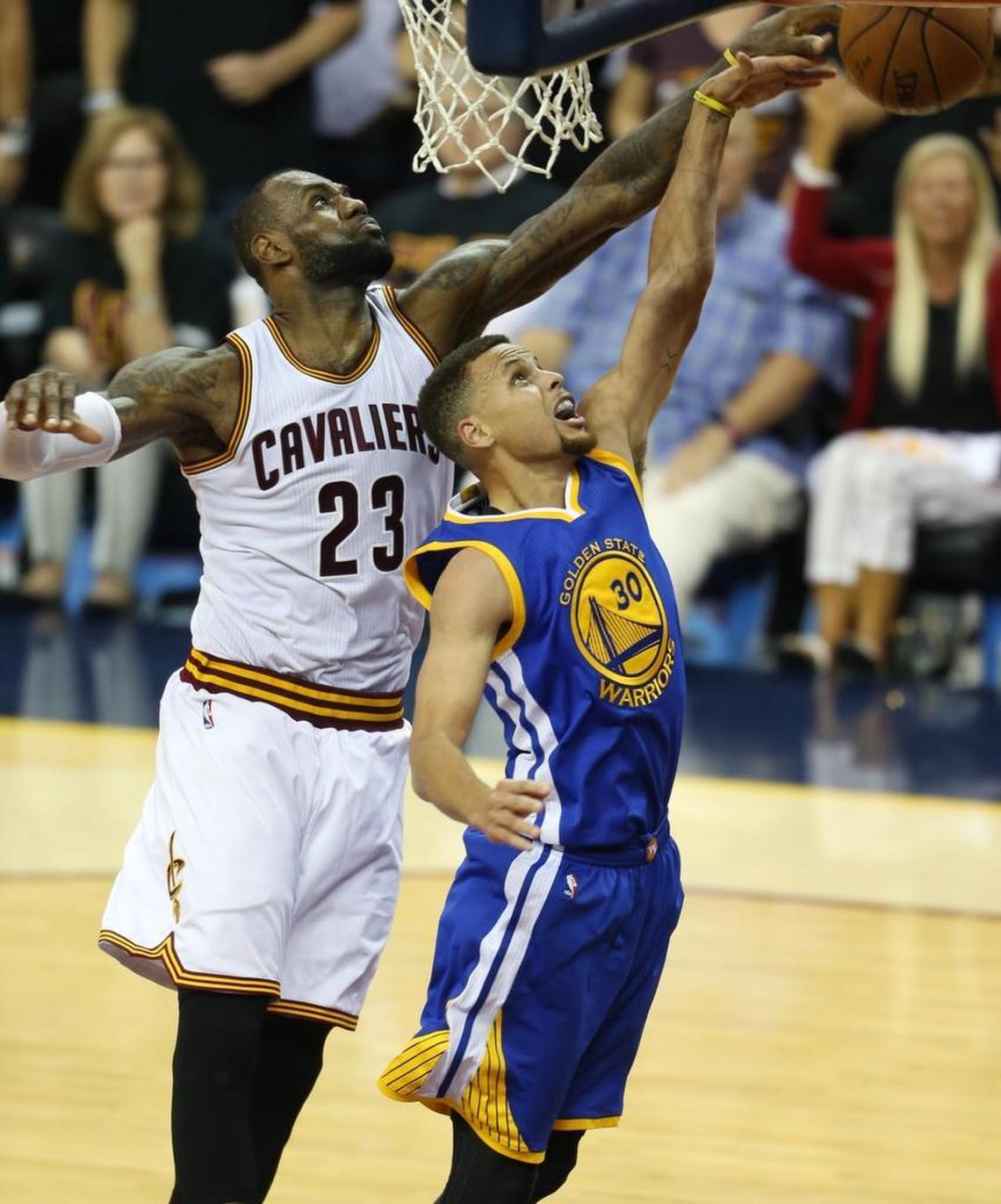 Cleveland Cavaliers forward LeBron James (23) blocks a shot by Golden State Warriors guard Stephen Curry (30) during the second half of Game 6 of basketball's NBA Finals in Cleveland, Thursday, June 16, 2016.