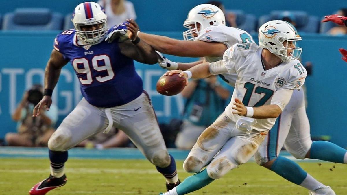
Dolphins quarterback Ryan Tannehill scrambles from Bills defensive lineman Marcell Dareus at Sun Life Stadium in Miami Gardens on Sept. 27, 2015.
