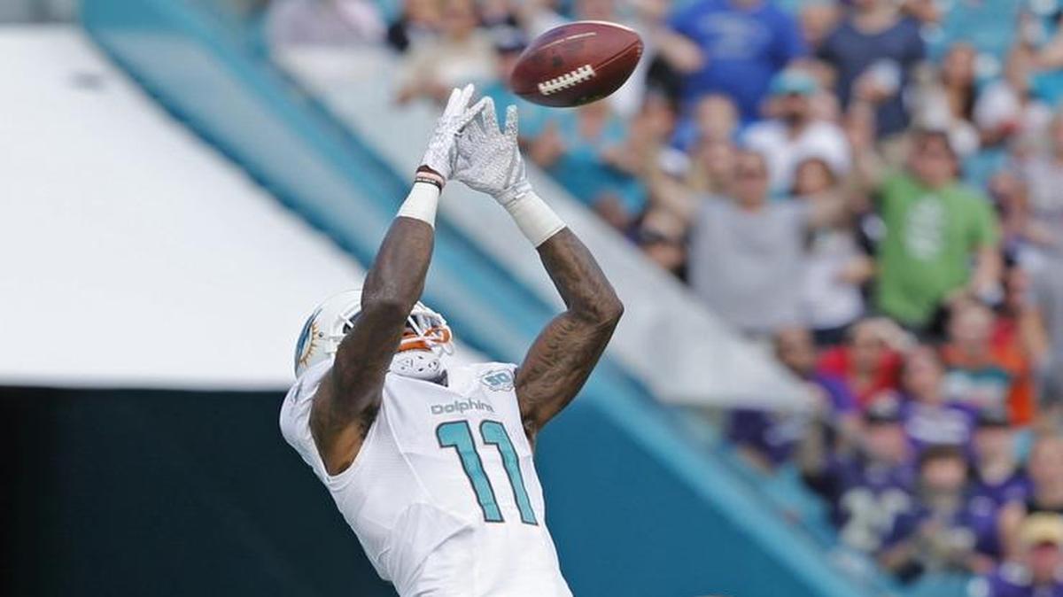 Miami Dolphins wide receiver DeVante Parker (11) scores in the second quarter as the Miami Dolphins host the Baltimore Ravens at Sun Life Stadium on Sunday, December 6, 2015.