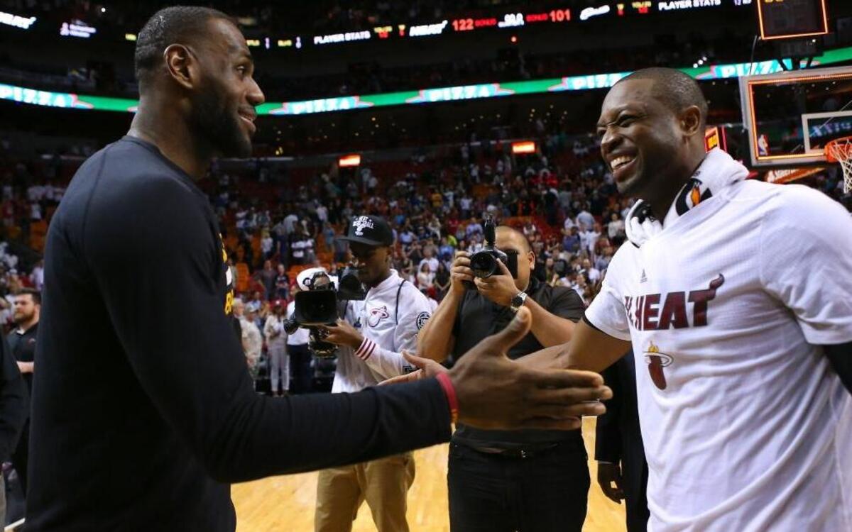 LeBron James, left, talks with Dwyane Wade, after a Heat at AmericanAirlines Arena on March 19, 2016.
