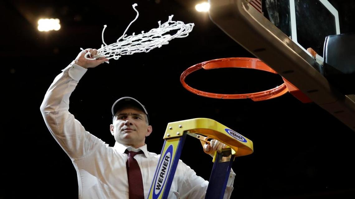 South Carolina head coach Frank Martin swings the net around after cutting it down after beating Florida 77-70 in the East Regional championship game of the NCAA men's college basketball tournament, Sunday, March 26, 2017, in New York.