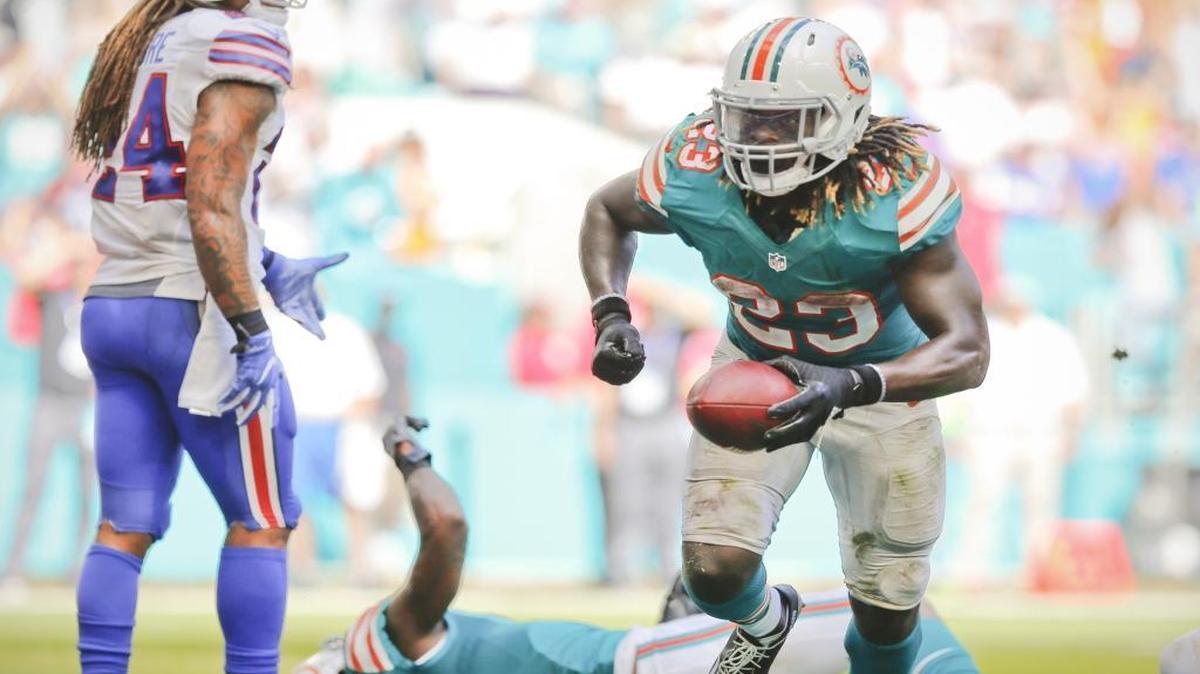 Miami Dolphins running back Jay Ajayi (23) scores in the third quarter as the Miami Dolphins host the Buffalo Bills at Hard Rock Stadium on Sunday, October 23, 2016.
