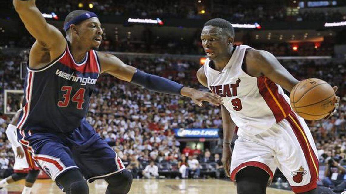 
Miami Heat forward Luol Deng (9) goes up against Washington Wizards forward Paul Pierce (34) in the third quarter as the Miami Heat hosts the Washington Wizards for the season opener at AmericanAirlines Arena on Wednesday, October 29, 2014.
